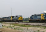 CSX 8771 leads a train northbound past the yard job